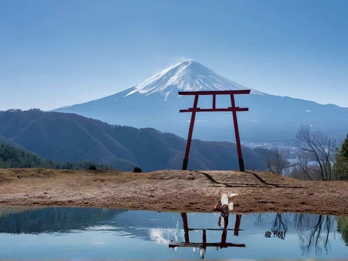 Mount Fuji Mount Fuji snow-capped peak at sunrise with lake reflection