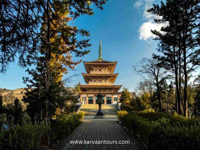 Pagoda structure at Zenkoji Temple surrounded by trees in Nagano City Japan