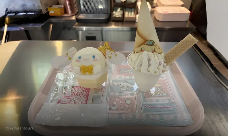 Cinnamoroll-themed desserts and drinks served on tray at Sanrio Puroland café in Tokyo