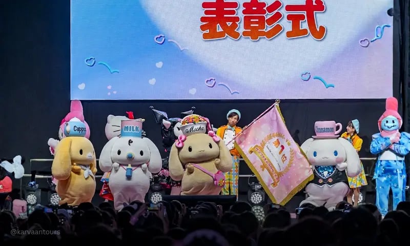 Sanrio characters on stage during awards ceremony event with audience at Sanrio Puroland Tokyo