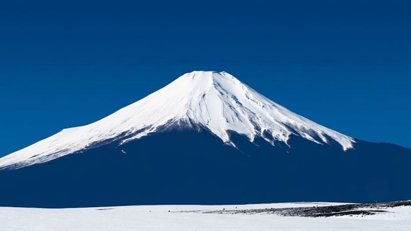 Iconic snow-capped Mount Fuji under a crisp blue winter sky.