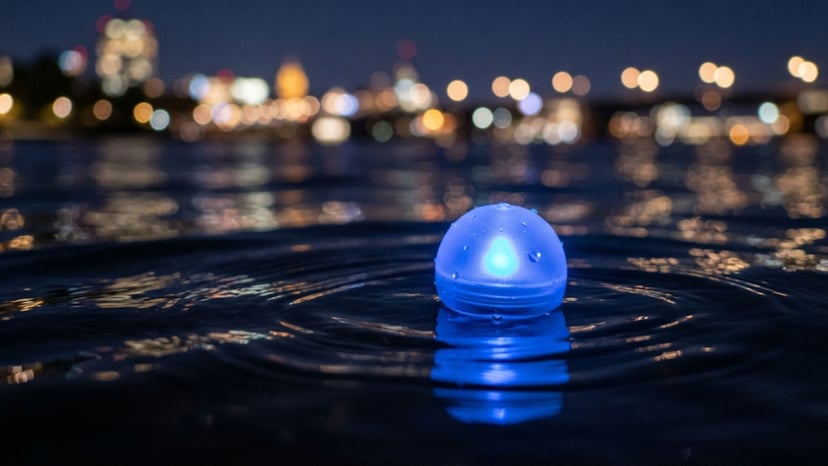 Glowing blue Inori Star sphere floating on water