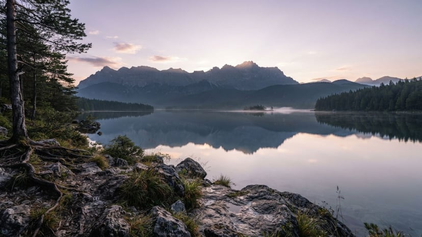 Peaceful waters of Lake Chuzenji with mountains in the background.